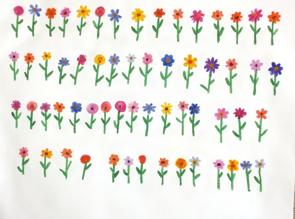 A child’s drawing of flowers set out in four even rows.